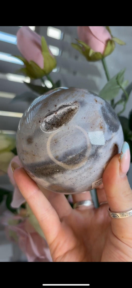 Pastel ocean jasper sphere in baby blue & grey tones with some druzy