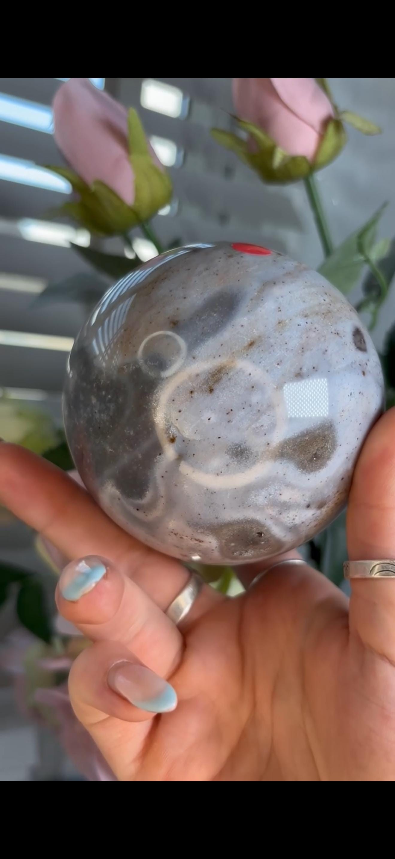 Pastel ocean jasper sphere in baby blue & grey tones with some druzy