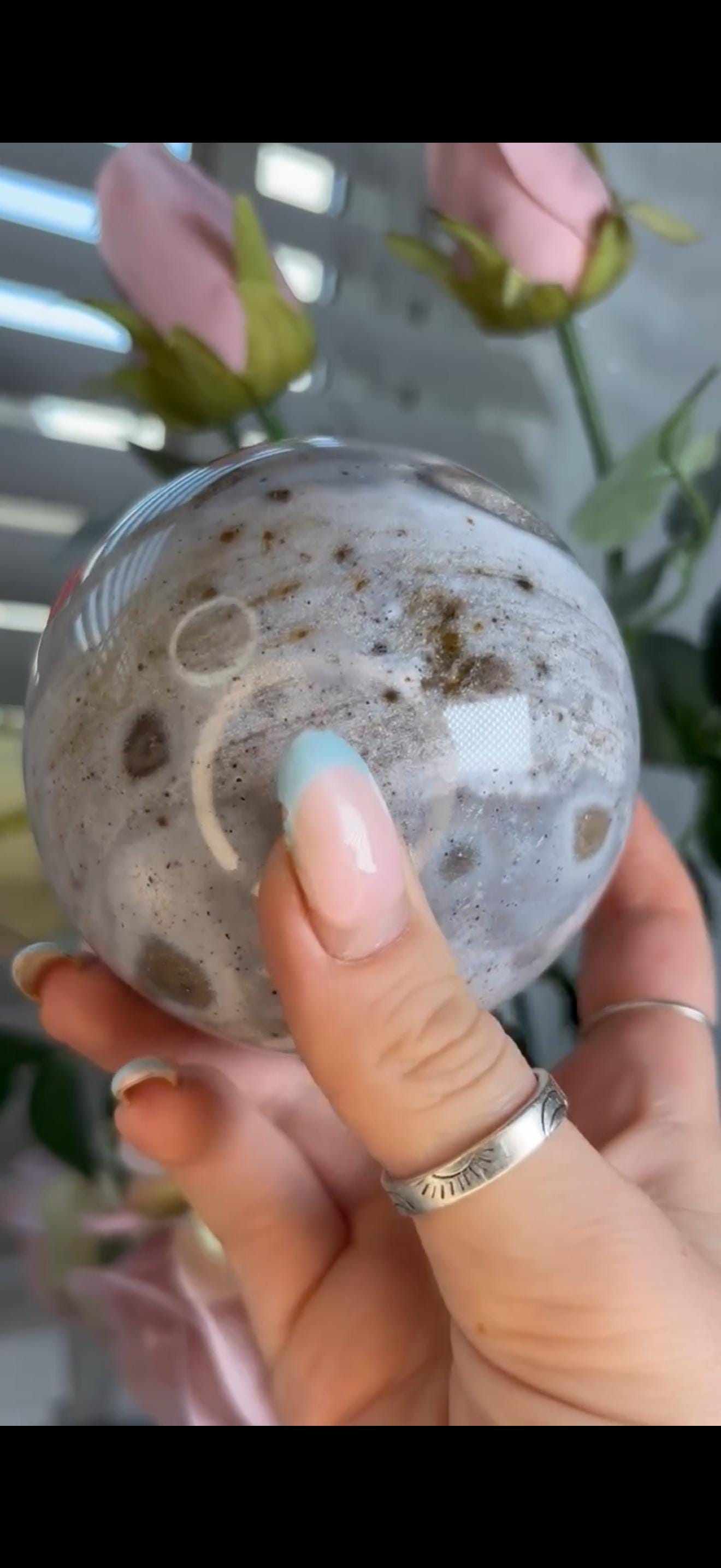 Pastel ocean jasper sphere in baby blue & grey tones with some druzy