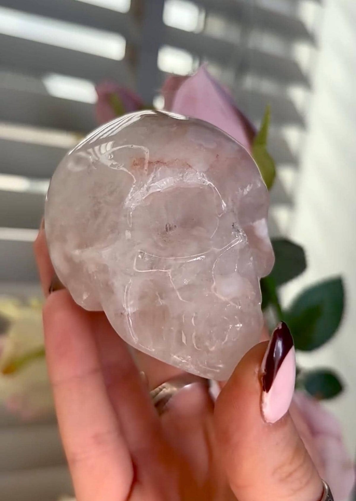 Flower agate skull in pink tones with red hematite lines