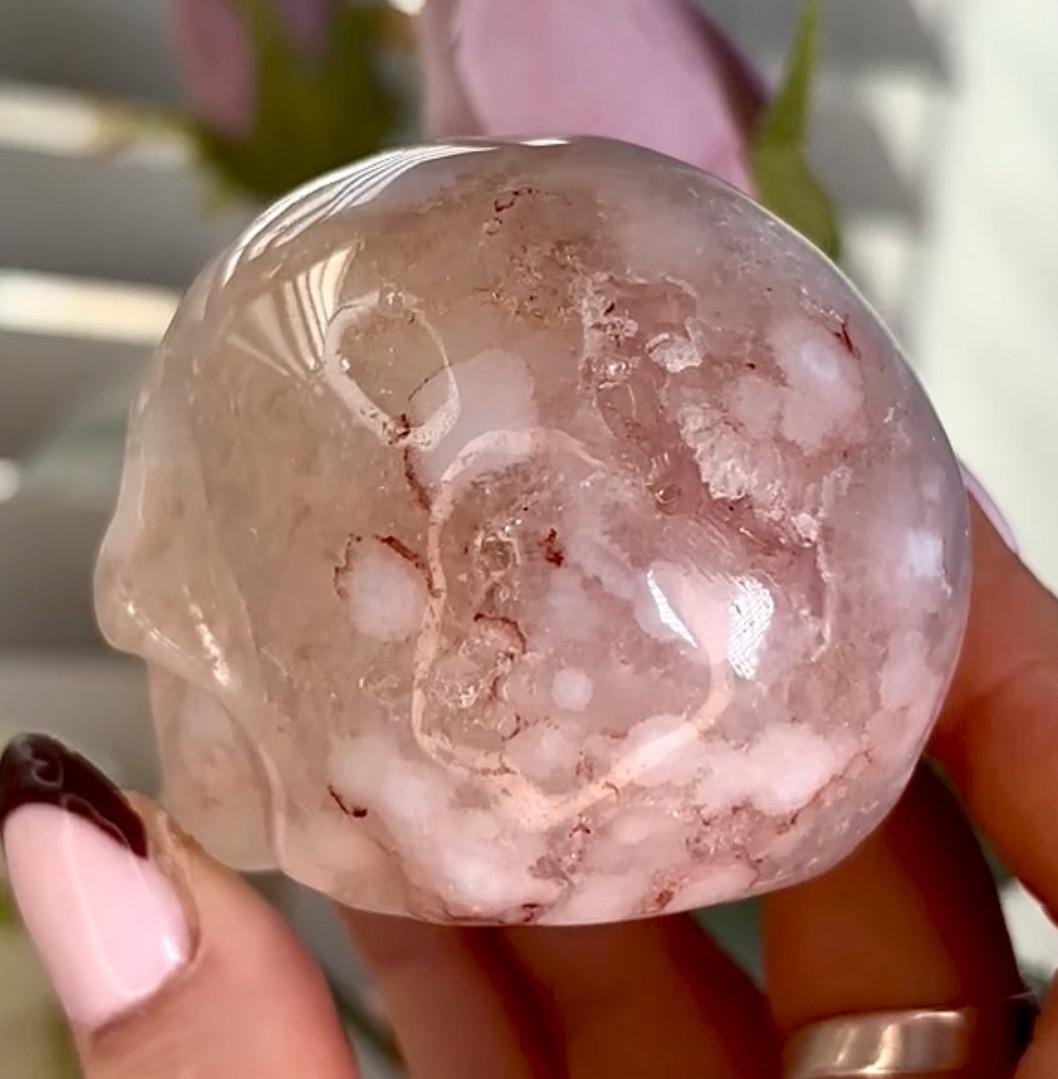 Flower agate skull in pink tones with red hematite lines