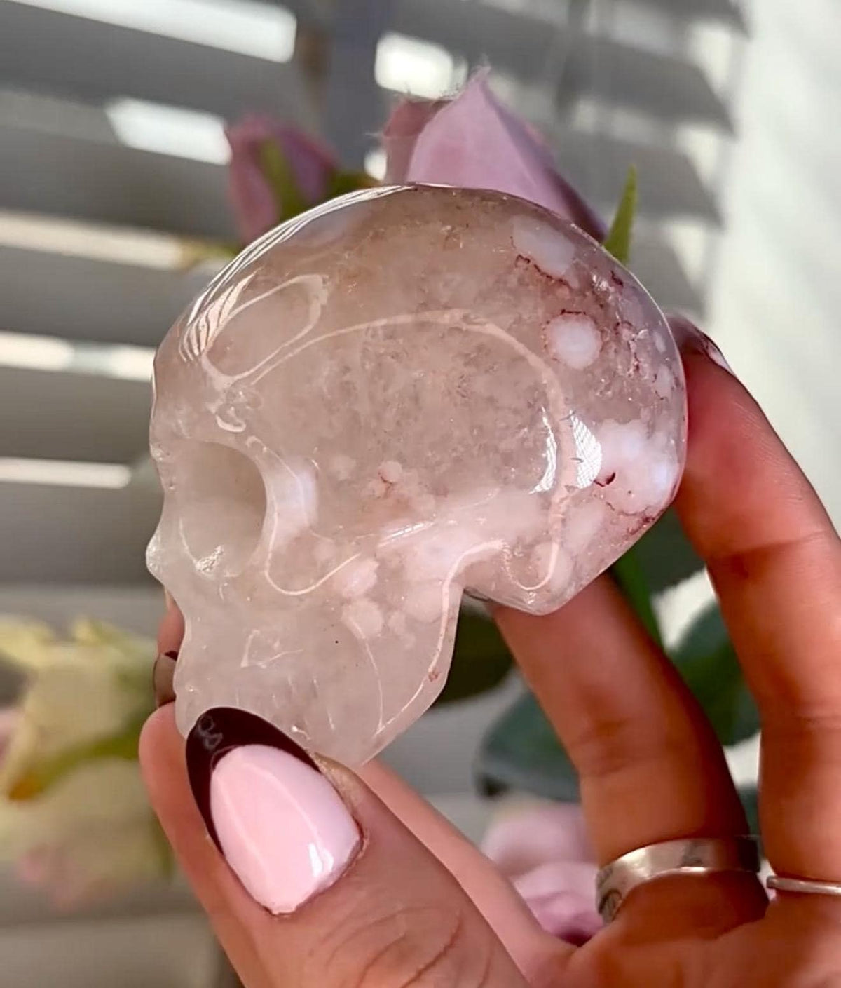 Flower agate skull in pink tones with red hematite lines