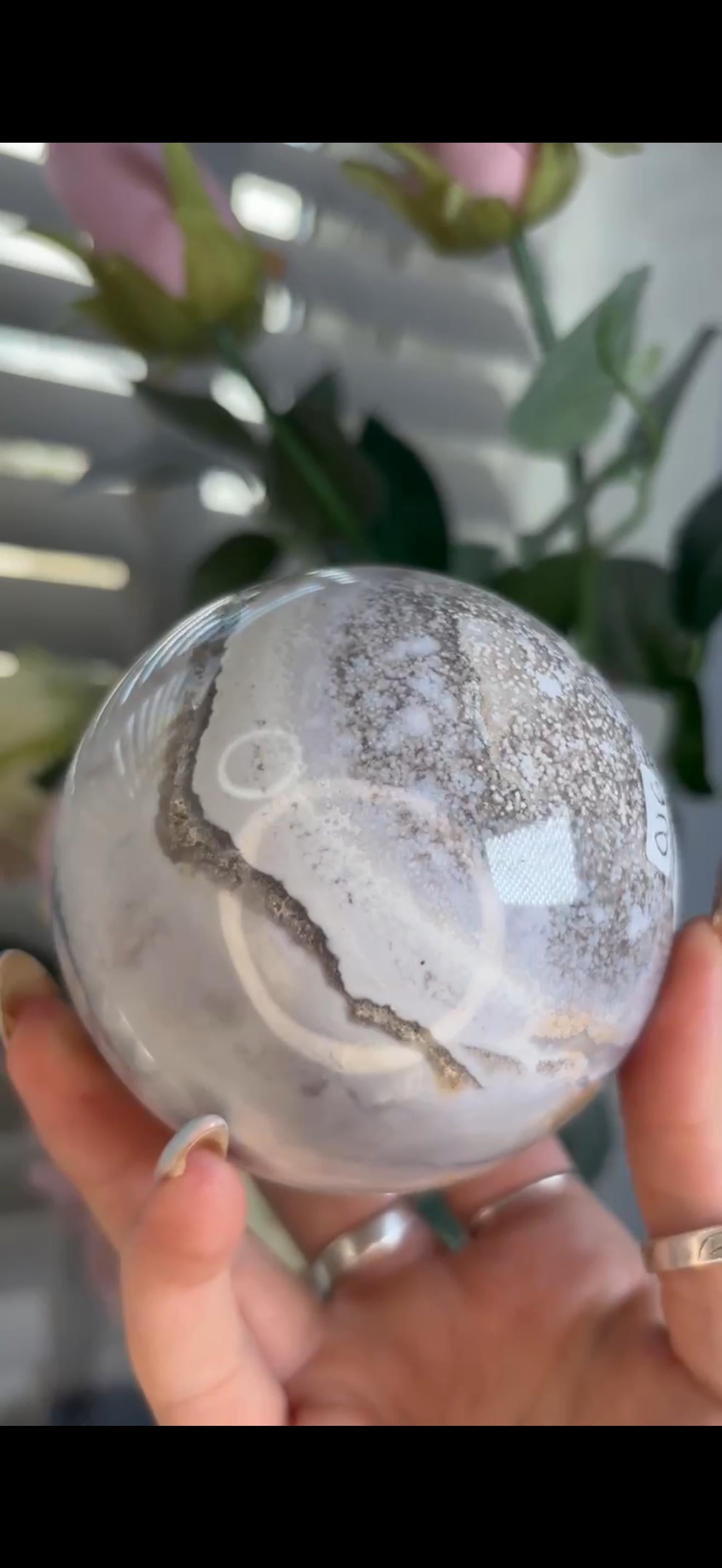 Pastel ocean jasper sphere in baby blue, white & dark blue tones with quartz