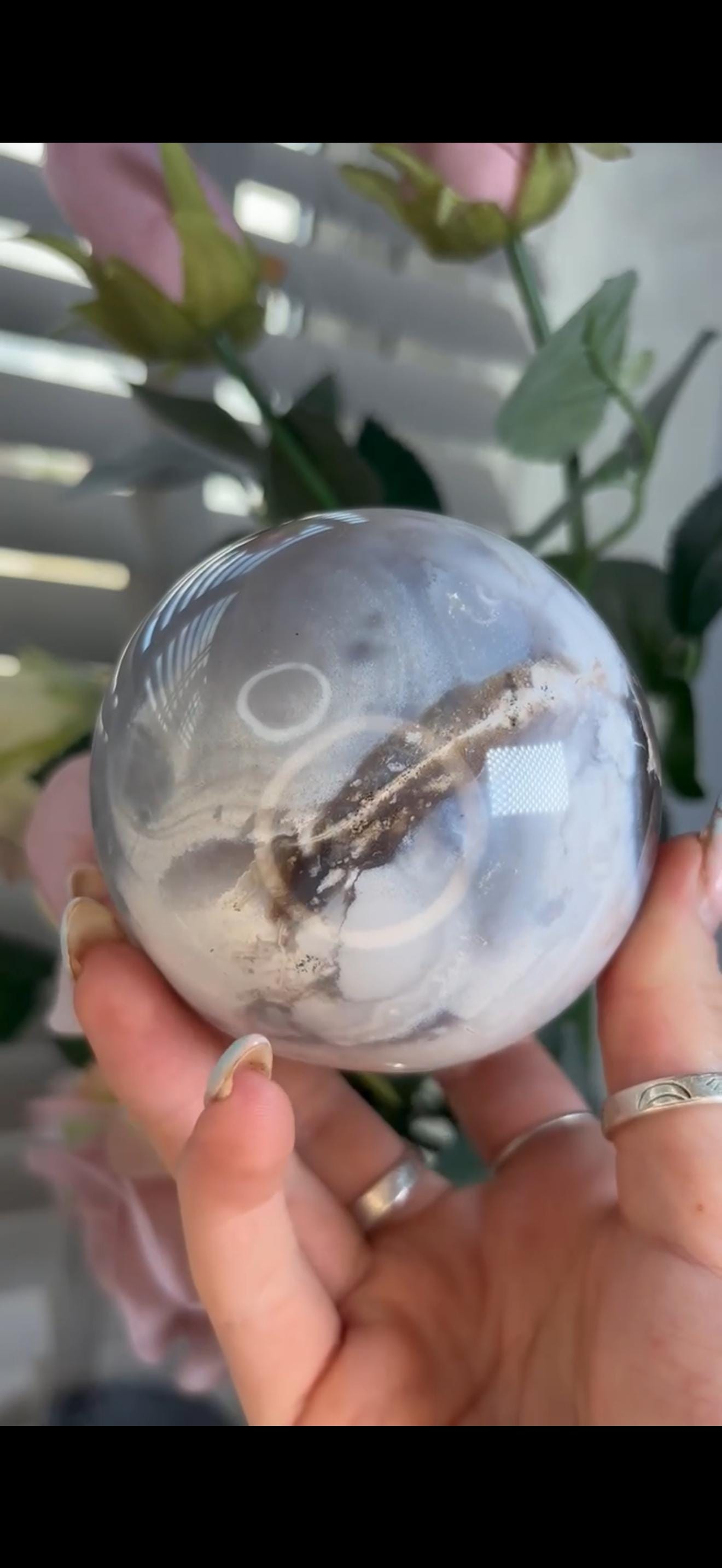 Pastel ocean jasper sphere in baby blue, white & dark blue tones with quartz