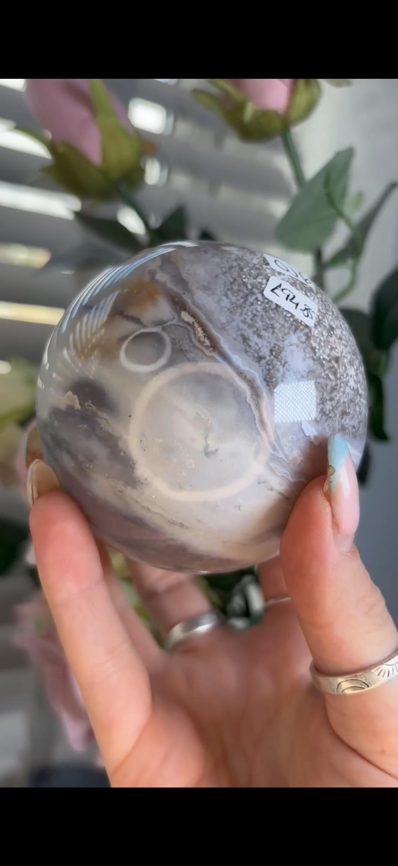 Pastel ocean jasper sphere in baby blue, white & dark blue tones with quartz
