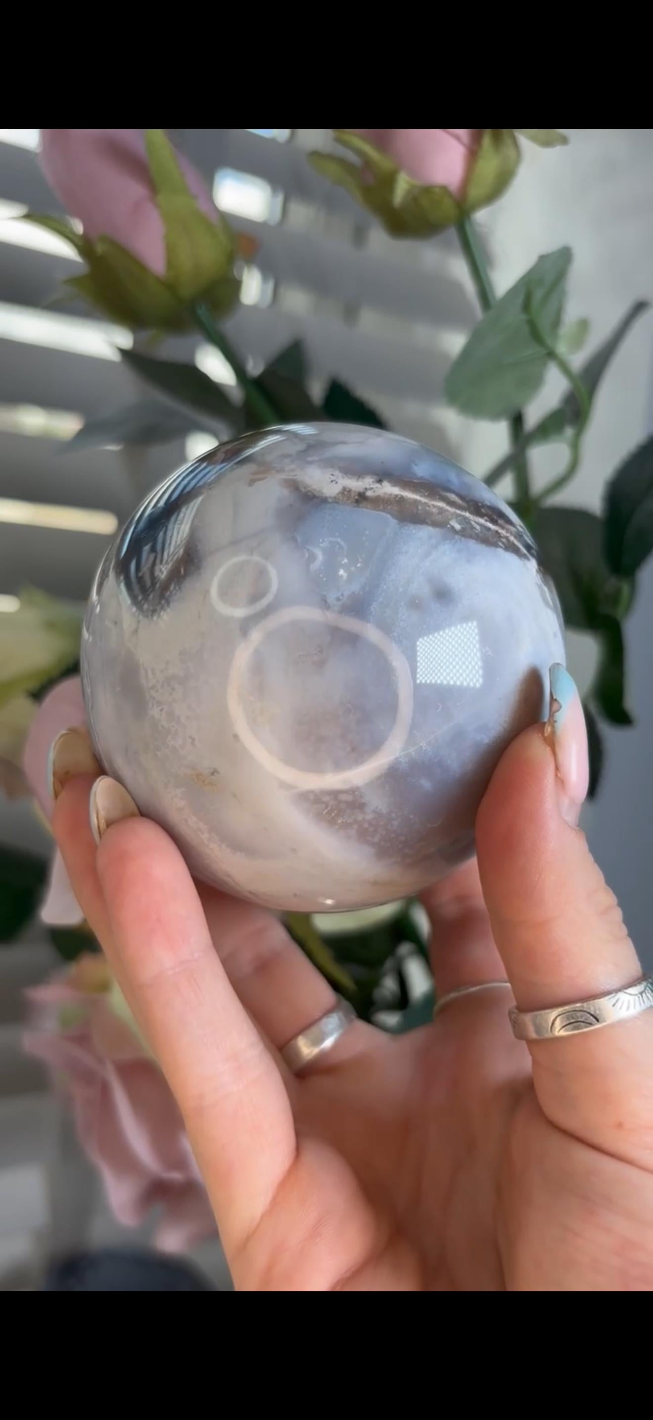 Pastel ocean jasper sphere in baby blue, white & dark blue tones with quartz