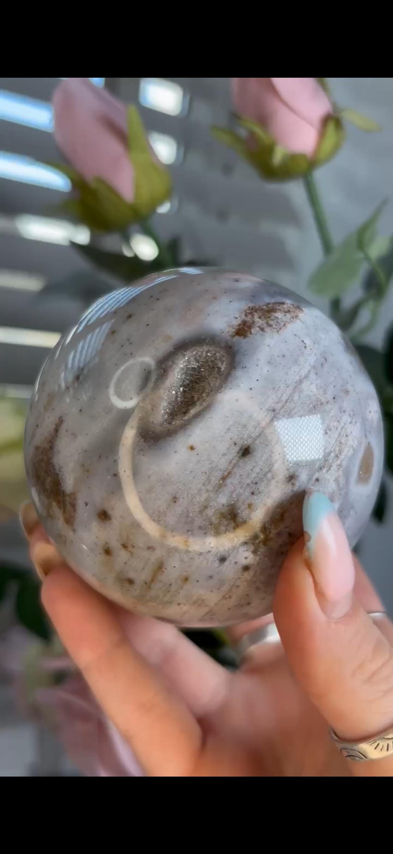 Pastel ocean jasper sphere in baby blue & grey tones with some druzy